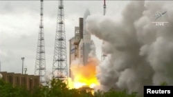 An Ariane 5 rocket, with NASA’s James Webb Space Telescope onboard, is launched from French Guiana on December 25, 2021.