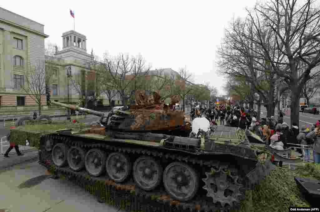 A Russian T-72 tank that was damaged during fighting in Ukraine stands in front of the Russian Embassy in Berlin, pictured in February 2023