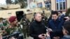 Acting U.S. Defense Secretary Patrick Shanahan (second from right) and acting Afghan Defense Minister Asadullah Khalid (right) visit an Afghan special force unit on the outskirt of Kabul on February 11.