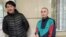 Asiya Tulesova (left) and Beibarys Tolymbekov before their trial at court in Almaty on April 21.