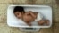 A malnourished baby is weighed at the Indira Gandhi Hospital in Kabul. (file photo)
