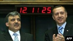 Then-Prime Minister Recep Tayyip Erdogan (right) announces that Abdullah Gul (left) would be the AKP party's candidate for president in Ankara in April 2007.