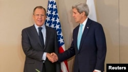 U.S. Secretary of State John Kerry (right) shook hands with Russian Foreign Minister Sergei Lavrov in Geneva on March 2, but neither made any public remarks before they began talks.