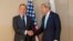 U.S. Secretary of State John Kerry (right) shook hands with Russian Foreign Minister Sergei Lavrov in Geneva on March 2, but neither made any public remarks before they began talks.