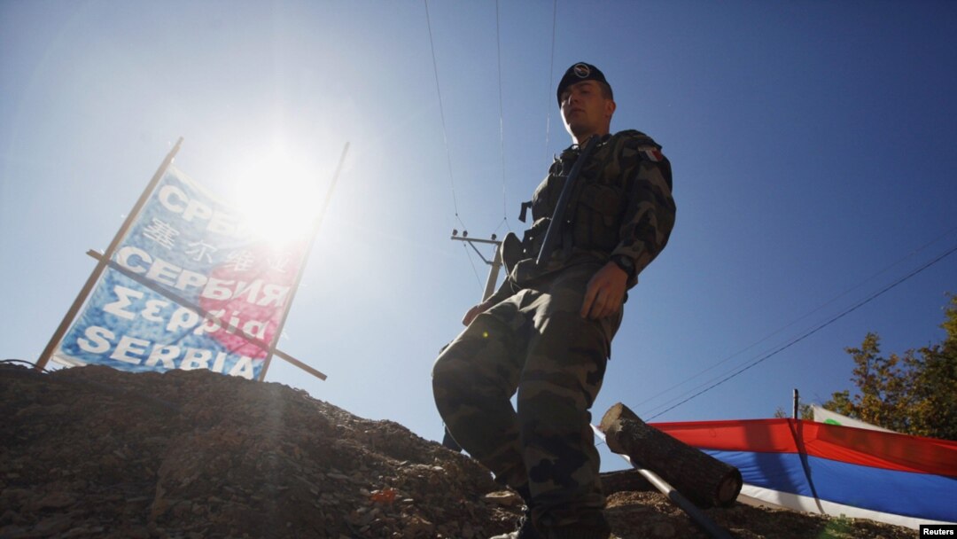 A KFOR soldier from France walks along barricades at the closed Serbia-Kosovo border crossing of Brnjak on October 19.