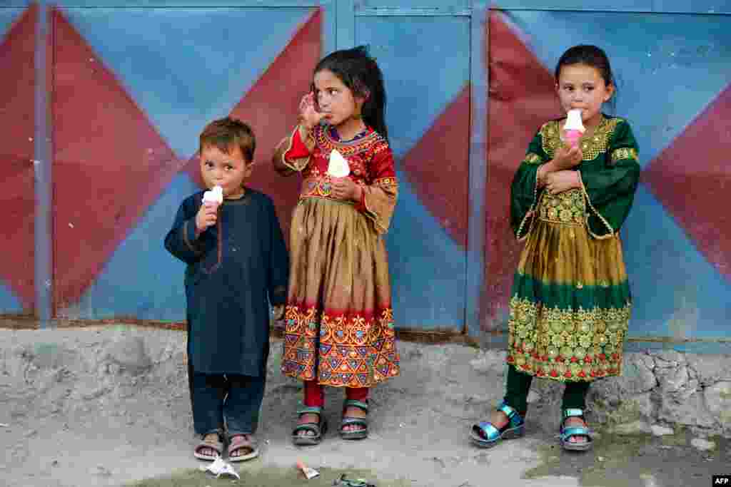 Afghan children eat ice cream in Badakhshan Province.