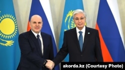 Президент Казахстана Касым-Жомарт Токаев и премьер-министр России Михаил Мишустин. Астана, 26 марта 2026 года
