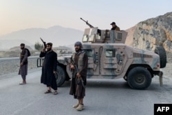 Taliban security personnel stand guard near the Torkham border crossing between Afghanistan and Pakistan in Nangarhar Province earlier this year.