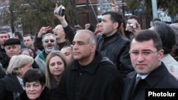 Armenia - Raffi Hovannisian (C), the leader of the opposition Zharangutyun party, looks on as thousands of people pour into Yerevan's Liberty Square, 18Mar2011.