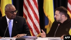 U.S. Secretary of Defense Lloyd Austin (left) and Ukrainian President Volodymyr Zelenskiy attend a previous meeting of the Ukraine Defense Contact Group meeting on September 6.