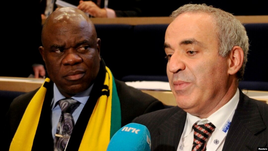 Garry Kasparov (right) answers questions from reporters after he lost the election to head the World Chess Federation in Norway on August 11. 