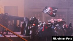 Столкновения между участниками антиправительственных выступлений и милицией на улице Грушевского в Киеве. 19 января 2014 года.