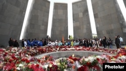 Armenia - People lay flowers at Yerevan's Tsitsernakabert memorial to victims of the 1915 Armenian genocide in Ottoman Turkey.
