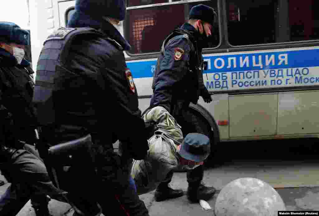 A demonstrator is taken away by police officers during a rally organized by nationalists and far-right activists on Russia&#39;s National Unity Day in Moscow on November 4. (Reuters/Maxim Shemetov)