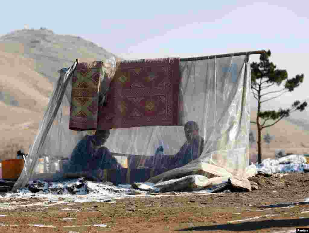 Men drink tea at a roadside tea shop on the outskirts of Kabul, Afghanistan. (Reuters/Omar Sobhani)