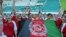 Afghan women's soccer team flies the national flag after beating Pakistan's Baluchistan team on August 22