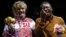 Claressa Shields (right) of the United States poses with her gold medal accompanied by silver medallist Nadezda Torlopova of Russia during the presentation ceremony for the women's middleweight boxing competition at the London Olympic Games on August 9. 