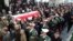 The honor guard carry the coffin of Iran's former ambassador to Lebanon Ghazanfar Roknabadi, who was killed in Saudi Arabia, during a repatriation ceremony upon the arrival of his body at Tehran's Mehrabad Airport on November 27, 2015. 
