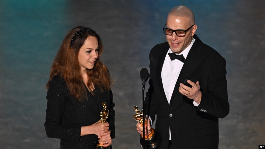 Iranian animator and film director Shirin Sohani (L) and Iranian animator Hossein Molayemi accept the award for Best Animated Short Film for "In the Shadow of the Cypress" onstage during the 97th Annual Academy Awards at the Dolby Theatre in Hollywood, Ca