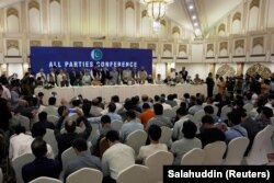 Leaders of the Pakistan's opposition political parties address the closing session of the All Parties Conference (APC) in Islamabad on September 20.
