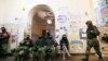 Protesters during their evacuation of Kyiv's city administration building on February 16.