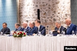 The Russian delegation, led by presidential adviser Vladimir Medinsky (center), sits across from Ukrainian officials (not pictured) in Istanbul on May 16.