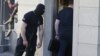 Armenia - An armed officer of the National Security Service guards an entrance to the Yerevan house of former President Serzh Sarkisian's brother Aleksandr searched by investigators, 4 July 2018.