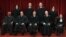 Associate Justice Antonin Scalia (2nd left, front row) sits among the other justices of the U.S. Supreme Court for a group portrait in Washington in October 2010.