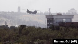 A U.S. Chinook helicopter flies near the U.S. Embassy in Kabul on August 15.