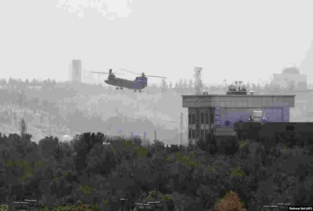 A U.S. Chinook helicopter flies near the embassy in Kabul. The United States started the withdrawal of its diplomats on August 15, as U.S. troops began arriving in Kabul to protect the evacuation operation and keep control of the airport.