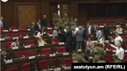 Armenia - Pro-government and opposition lawmakers clash during a session of the National Assembly, August 11, 2021