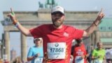 Jared Goldman finishing marathon in Berlin