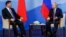 Russian President Vladimir Putin (right) speaks with Chinese President Xi Jinping during their meeting on the sidelines of the Eastern Economic Forum in Vladivostok on September 11.