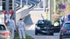 Forensic officers examine a damaged car at the site of a car ramming attack in Mannheim, southwestern Germany on March 3, 2025.