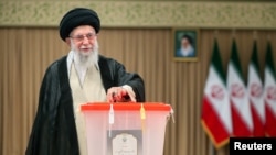 Iran's supreme leader, Ayatollah Ali Khamenei, casts his vote during the presidential election in Tehran on July 5.