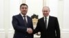 Kyrgyz President Sadyr Japarov (left) meets with Russian President Vladimir Putin in February.