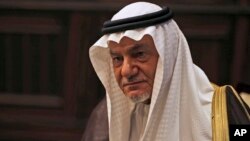 Saudi Prince Turki al-Faisal talks to the Associated Press in Abu Dhabi, United Arab Emirates, Saturday Nov. 24, 2018. A prominent Saudi royal says whether or not heads of state gathered in Argentina next week for the Group of 20 summit warmly engage with