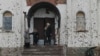 Orthodox worshipers stand outside a church after a Christmas service in Russian-occupied Donetsk on January 7. 