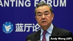 CHINA -- Chinese Foreign Minister Wang Yi delivers his opening remarks at the Lanting Forum on in Beijing, February 22, 2021