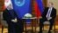 Iranian President Hassan Rohani (left) meets with Russian President Vladimir Putin on the sidelines of the SCO summit in Qingdao, China, on June 9.