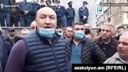 Armenia -- Kajaran Mayor Manvel Paramazian (L) leads a demonstration outside a police station in Kapan, May 24, 2020