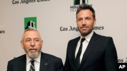 Ben Affleck, right, a cast member and director of the film "Argo," poses with former C.I.A. agent Tony Mendez, whom he portrays in the film, backstage at the 16th Annual Hollywood Film Awards Gala on Monday, Oct. 22, 2012, in Beverly Hills, Calif. (Photo 