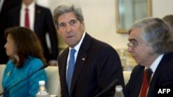 Former US Secretary of State John Kerry (C) and former US Secretary of Energy Ernest Moniz (R), who were the main U.S. negotiators in talks on Iran nuclear deal.