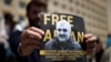 A man attends a rally on May 31 in Tbilisi to support Azerbaijani journalist Afqan Muxtarli, who was reportedly abducted in the Georgian capital on May 29 and is now in detention in Baku.