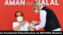Indonesian President Joko Widodo, shown receiving a coronavirus vaccine in July 2021, said the $1.4 billion global pandemic fund was not enough, and that said $31 billion was needed to sufficiently prepare for the next global pandemic.