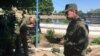 Investigators work at the site of the accident at the sewage plant in the village of Dmitriadovka outside Taganrog.