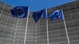 BELGIUM -- European Union flags flutter outside the EU Commission headquarters in Brussels, Belgium June 20, 2018. 