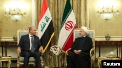 Iran's President Hassan Rouhani meets with Iraq's President Barham Salih in Tehran, Iran, November 17, 2018. Official President website/Handout 