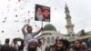 FILE: Supporters of the Tehreek-Labaik Pakistan (TLP) party shout slogan on the arrival of the leader Khadim Hussain Rizvi at an anti-terrorist court in Lahore, February 2019.