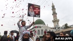 FILE: Supporters of the Tehreek-Labaik Pakistan (TLP) party shout slogan on the arrival of the leader Khadim Hussain Rizvi at an anti-terrorist court in Lahore, February 2019.